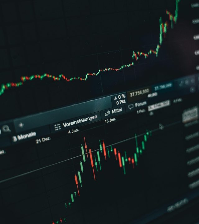 pexels-photo-6770775-6770775 Close-up of a digital market analysis display showing Bitcoin and cryptocurrency price trends.